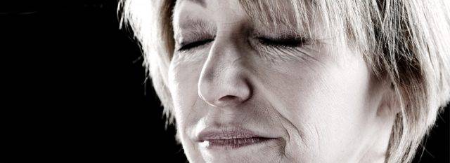 woman with eyes closed 640x233